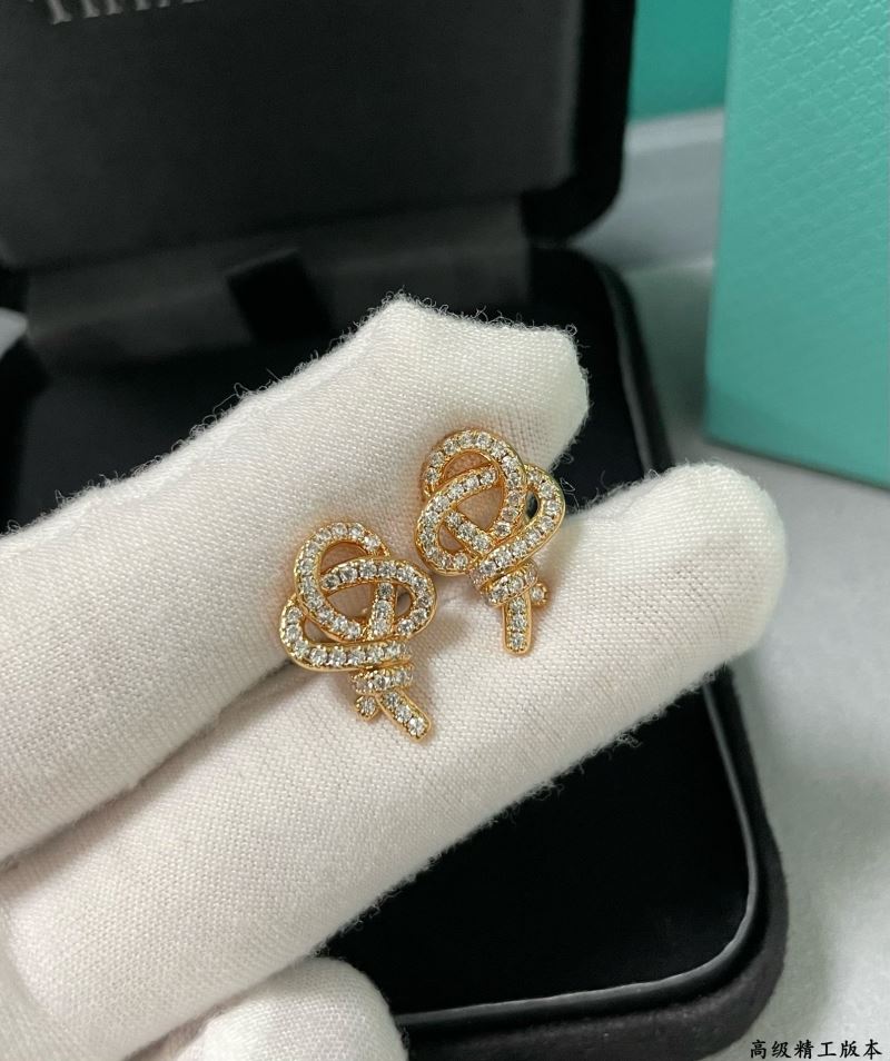 T*f*ny earrings